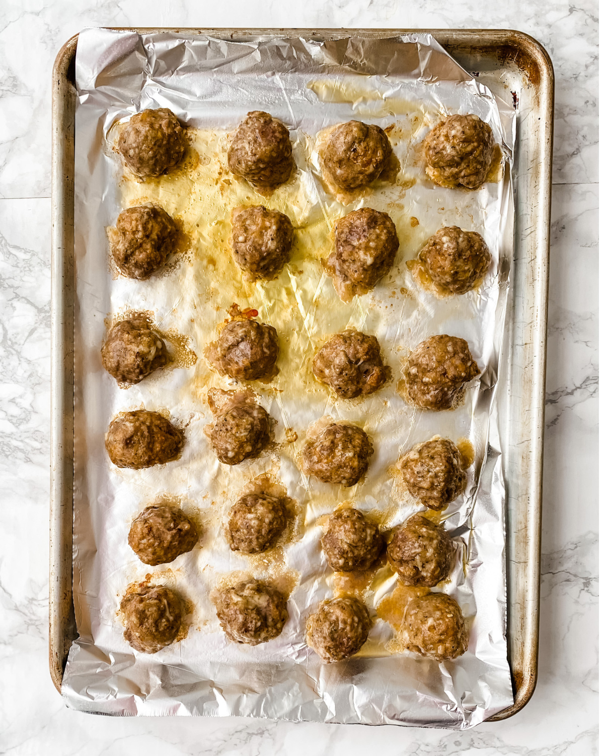 gf meatballs cooked on a pan.