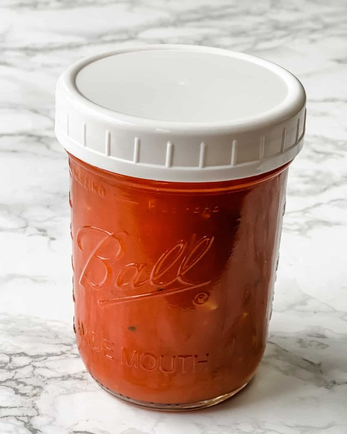 pizza sauce in a mason jar with a lid.