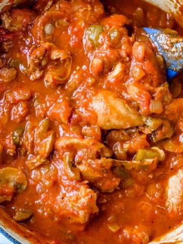 Close-up picture of Chicken cacciatore in a pot.
