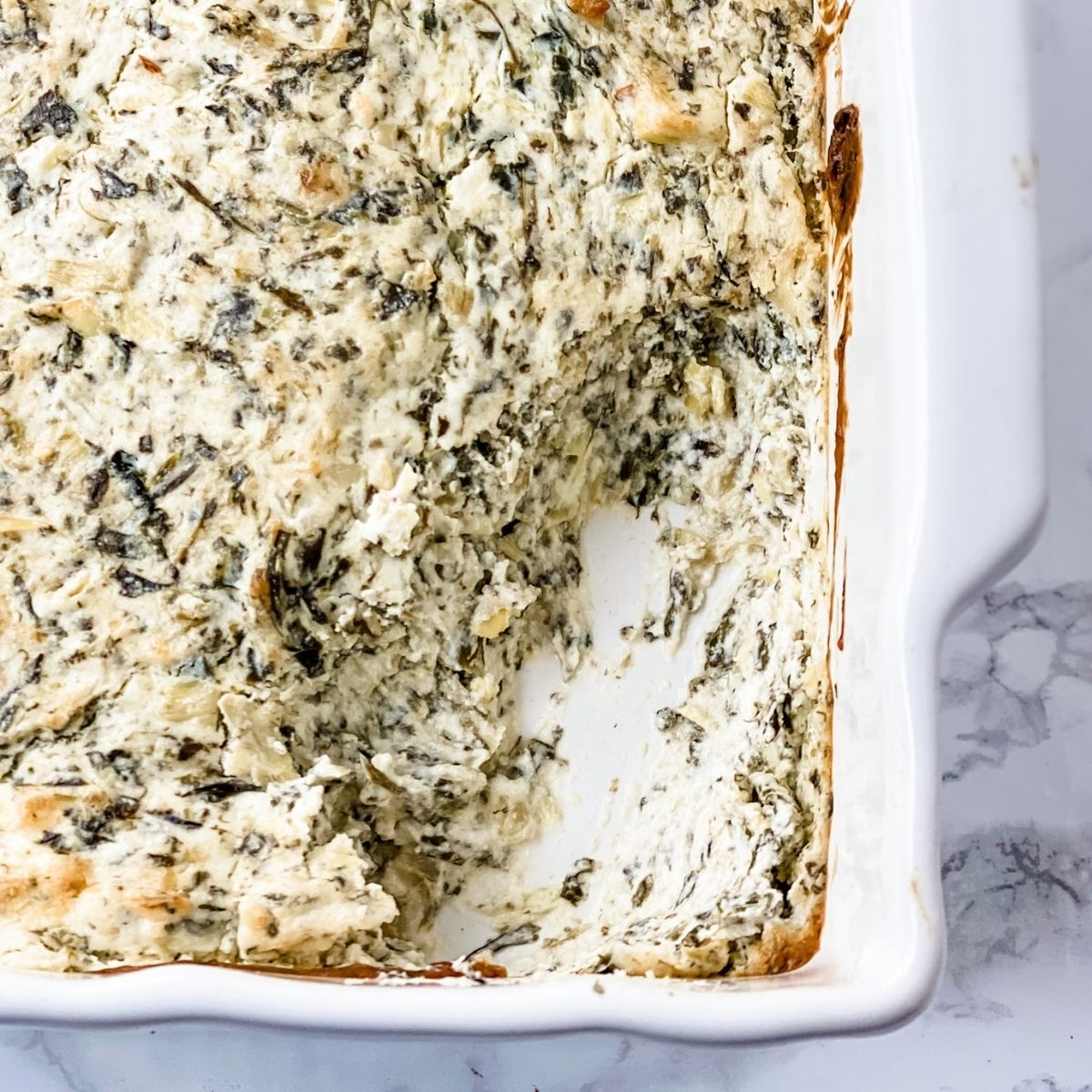 overhead picture of hot spinach artichoke dip