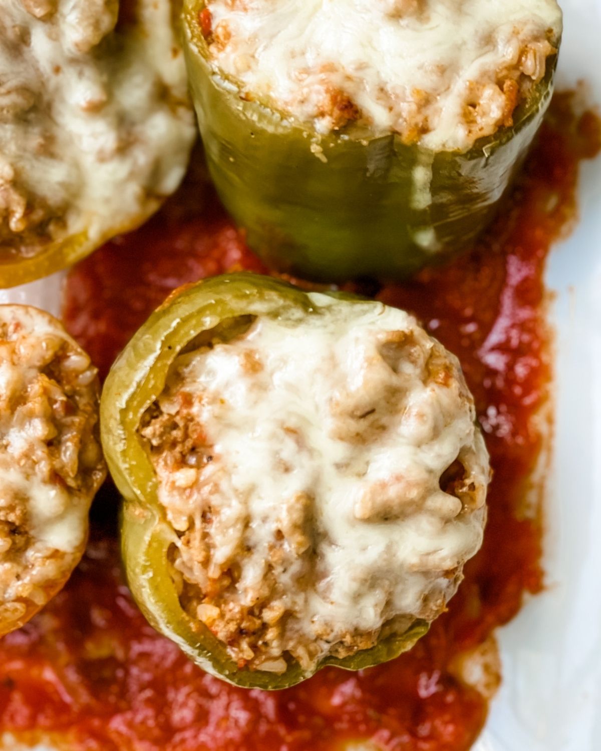 Close-up picture of italian stuffed peppers on a platter.
