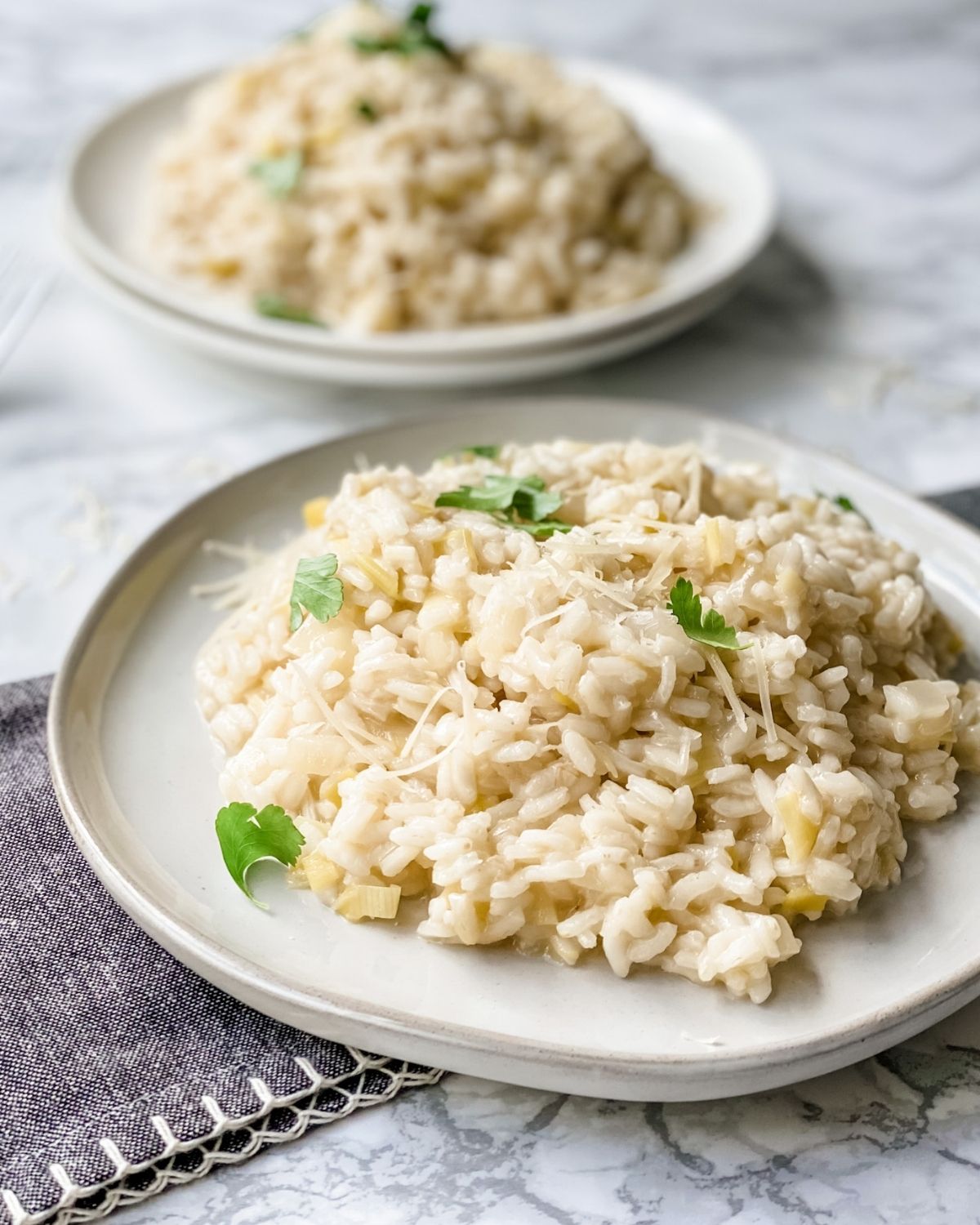 close up picture of creamy risotto on a plate.