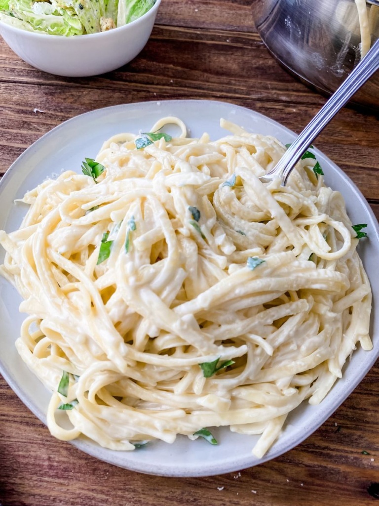 overhead picture of fettuccine alfredo on a plate.