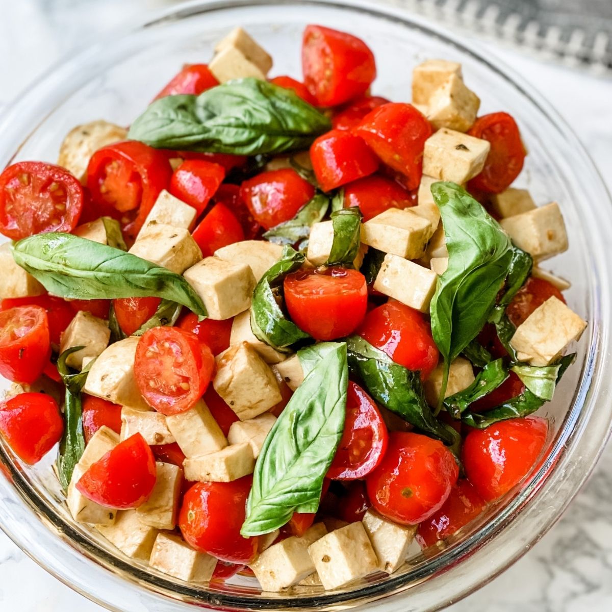 overhead picture of caprese salad with cherry tomatoes.