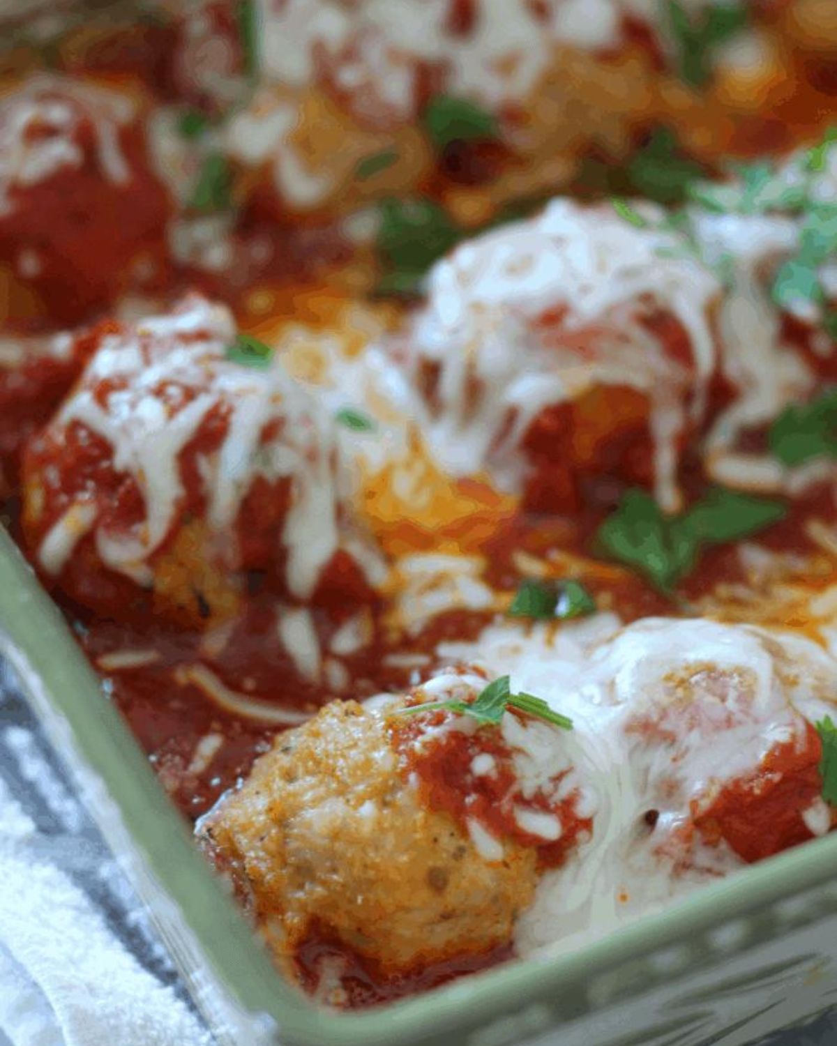 cooked chicken meatballs in a casserole dish.
