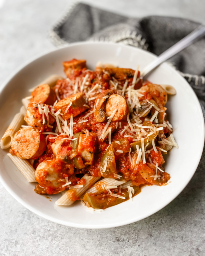 sausage cacciatore on a plate with fork.