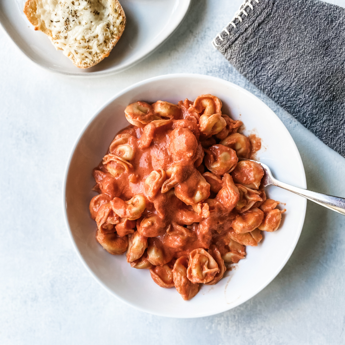 overhead image of tortellini with rose sauce