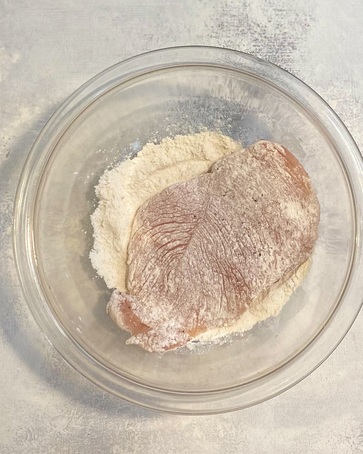 raw chicken breast in flour