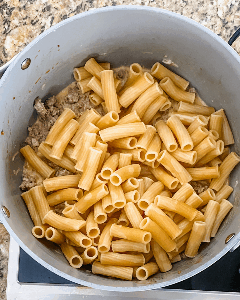 Add rigatoni to the pot