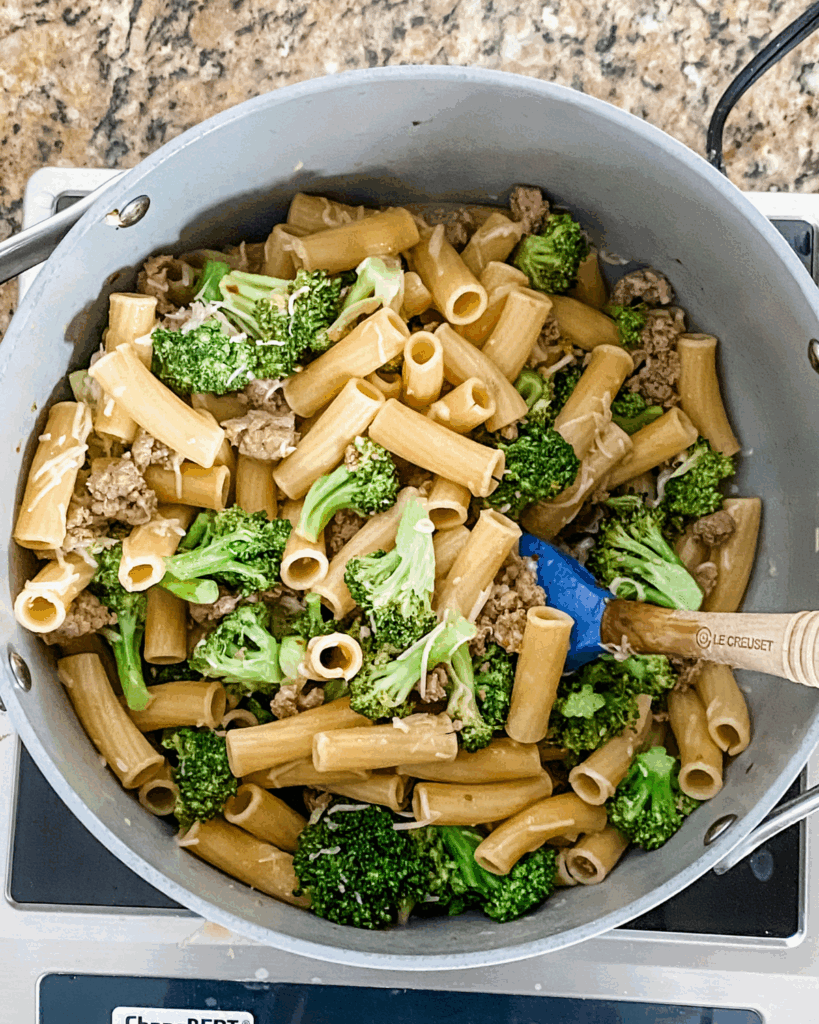 Stir pasta and broccoli and sausage in with the cheese.