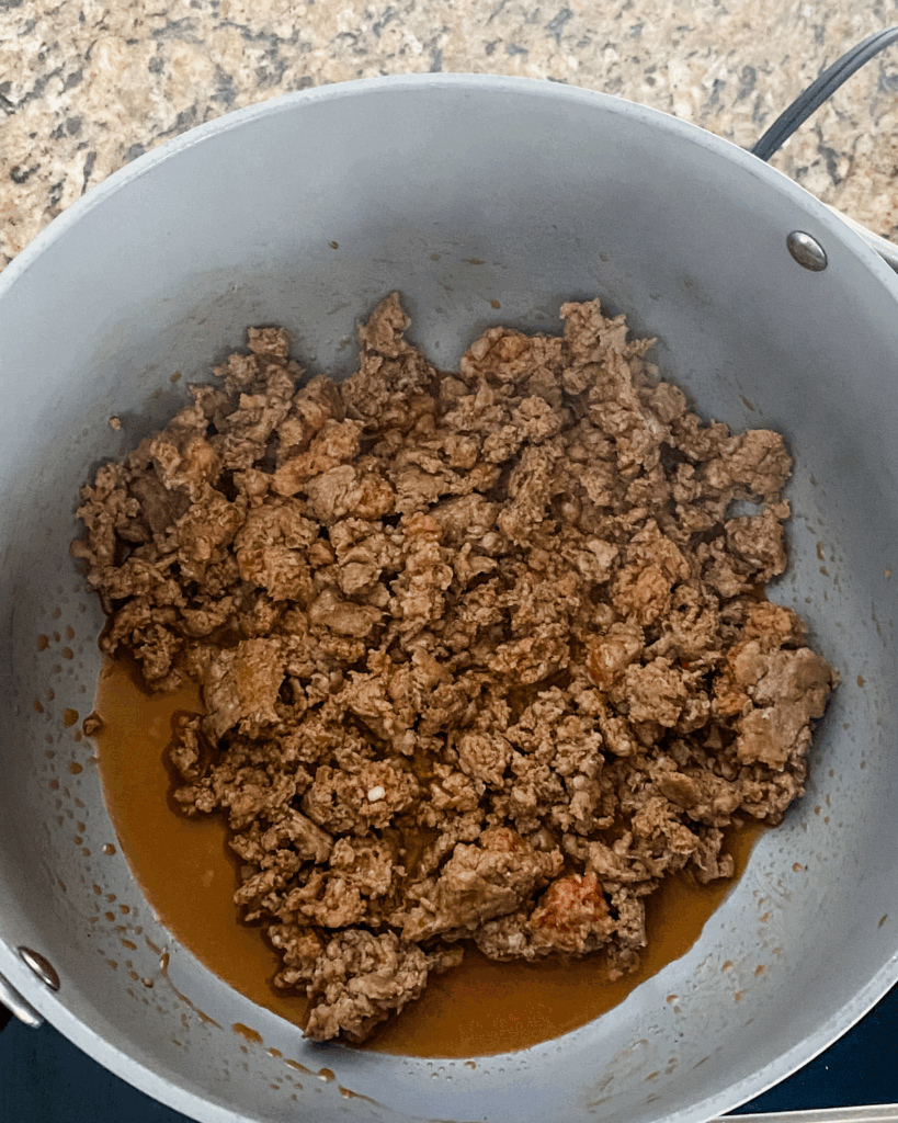 cooking italian sausage in a pot