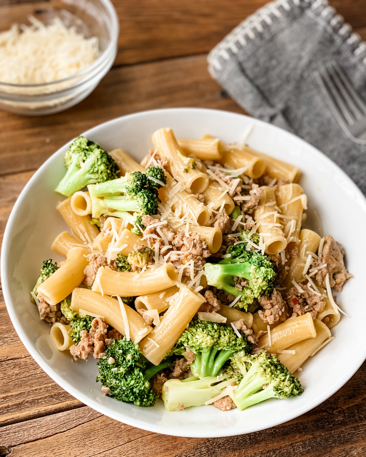 close up side view of pasta sausage and broccoli.